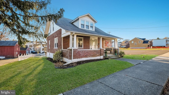 view of front of house featuring a front lawn and a porch