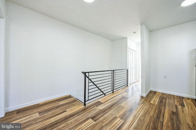 spare room featuring dark wood-type flooring