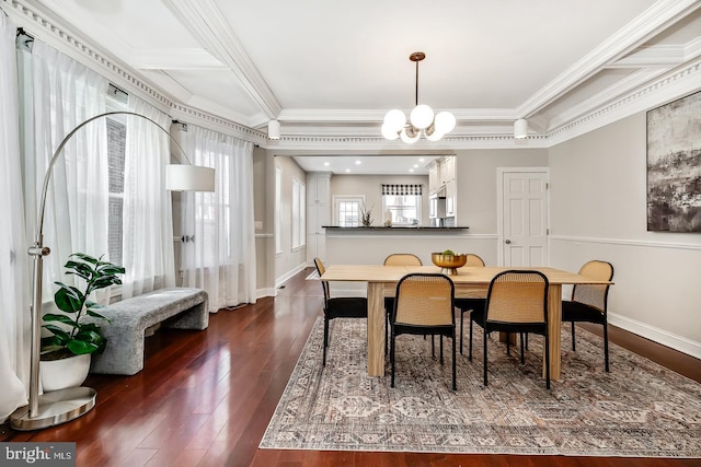 dining area with ornamental molding, dark hardwood / wood-style floors, and a notable chandelier