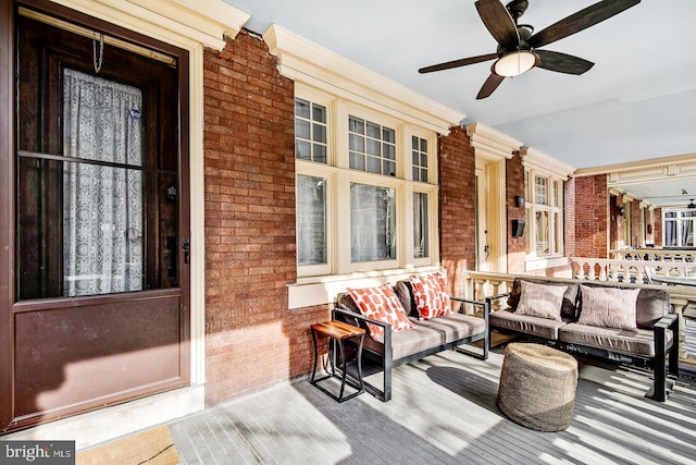 view of patio with ceiling fan and a porch