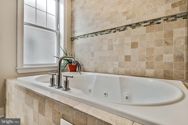 bathroom featuring a relaxing tiled tub