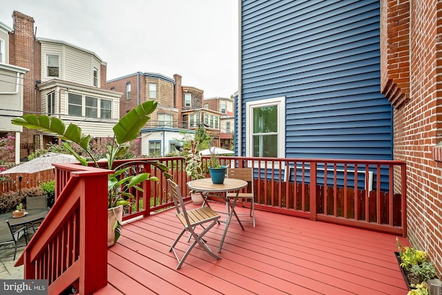 wooden deck featuring outdoor dining area