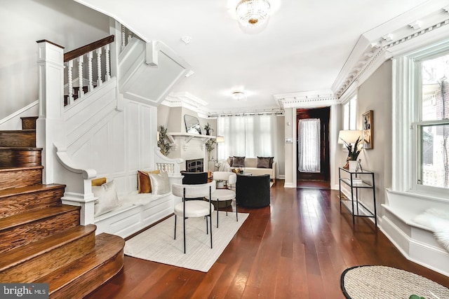 foyer featuring crown molding and dark hardwood / wood-style floors