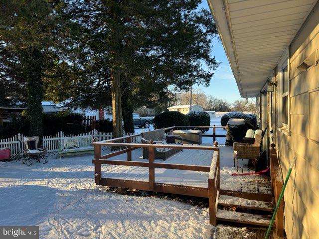 view of snow covered deck