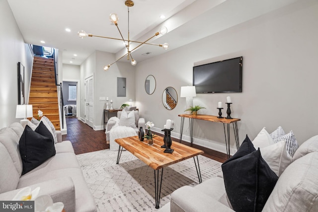 living room with hardwood / wood-style flooring and electric panel