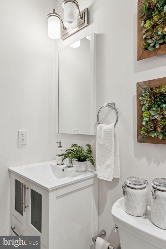 bathroom with vanity and toilet