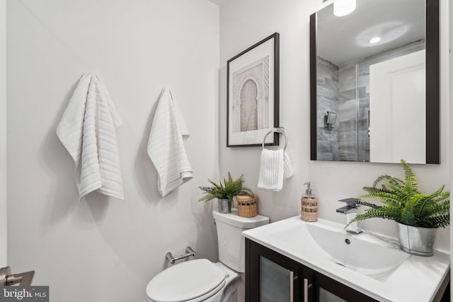 bathroom featuring vanity and toilet