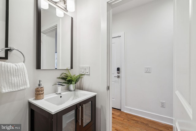 bathroom featuring hardwood / wood-style flooring and sink