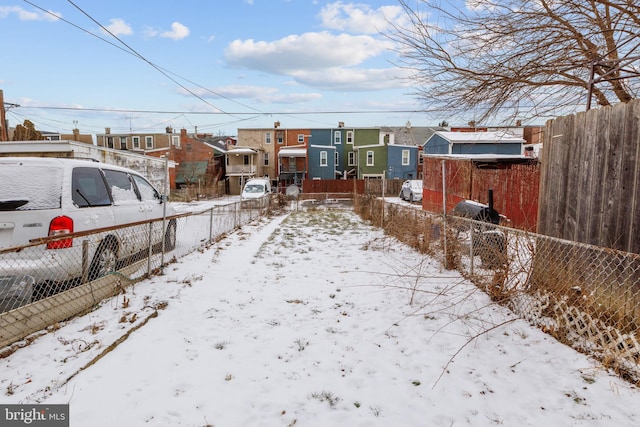 view of yard covered in snow