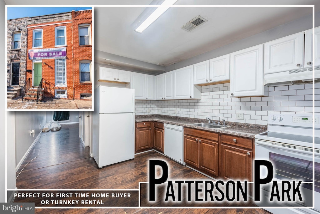 kitchen with sink, white cabinetry, tasteful backsplash, dark hardwood / wood-style floors, and white appliances