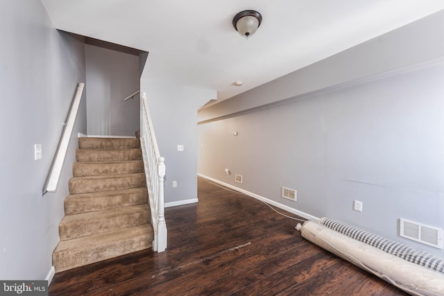 stairway featuring hardwood / wood-style flooring