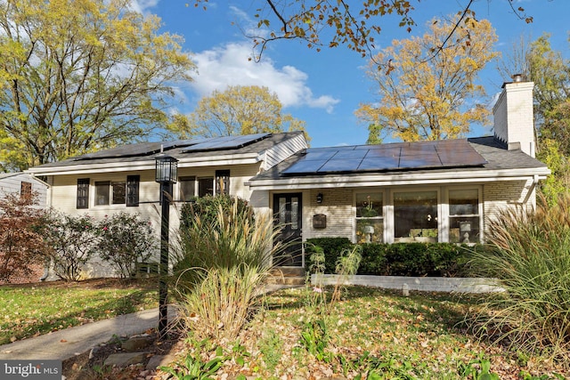 view of front of home with solar panels