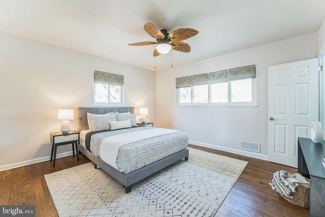 bedroom featuring dark wood-type flooring and ceiling fan