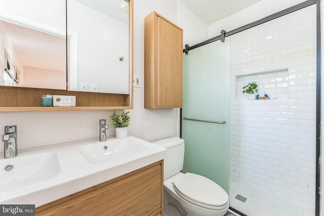 bathroom with vanity, toilet, and walk in shower