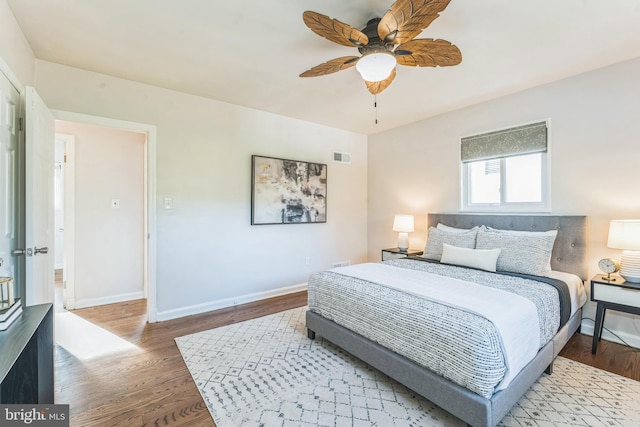 bedroom with hardwood / wood-style flooring and ceiling fan