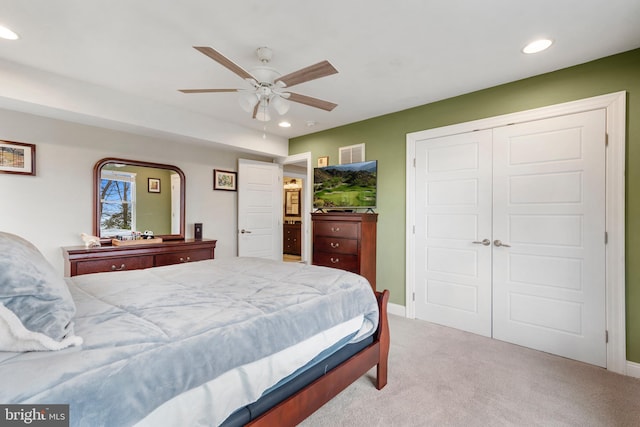 bedroom with light carpet, baseboards, a ceiling fan, a closet, and recessed lighting