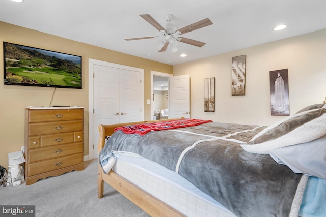 bedroom with recessed lighting, a closet, light carpet, and ceiling fan