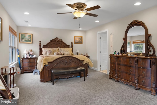 bedroom featuring light carpet, baseboards, visible vents, a ceiling fan, and recessed lighting