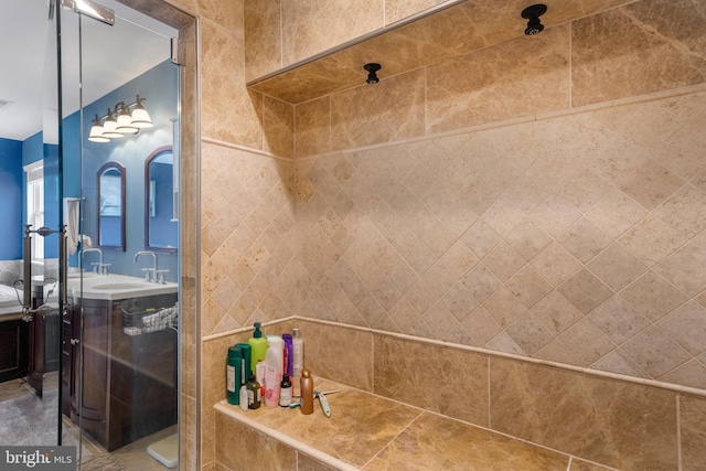 full bath featuring a stall shower and vanity