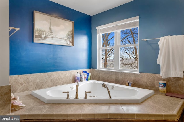 bathroom featuring tiled bath