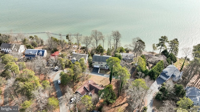 birds eye view of property featuring a water view and a residential view