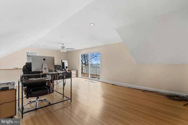 home office featuring light wood-type flooring, lofted ceiling, baseboards, and recessed lighting