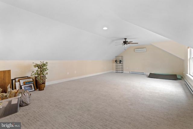 bonus room with carpet flooring, baseboards, vaulted ceiling, baseboard heating, and a wall mounted air conditioner