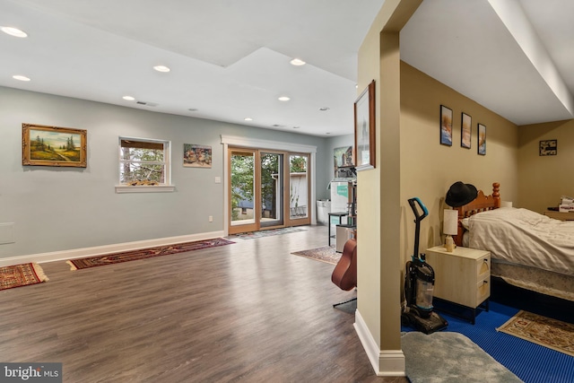 bedroom with visible vents, baseboards, dark wood-type flooring, access to exterior, and recessed lighting