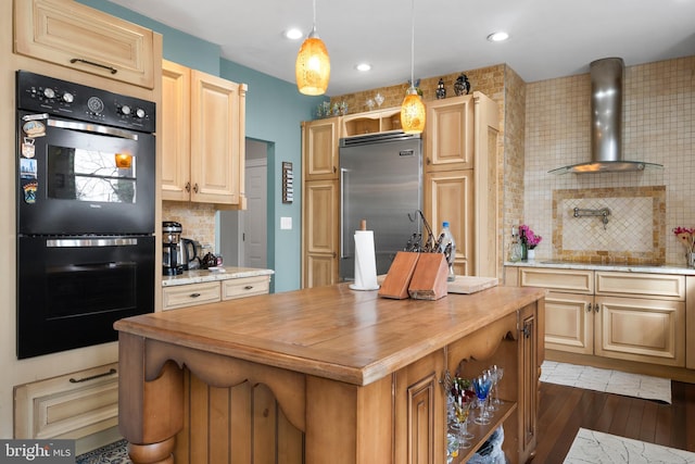 kitchen with wall chimney exhaust hood, decorative light fixtures, a center island, black appliances, and open shelves