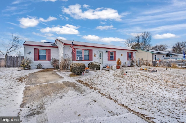 ranch-style home featuring cooling unit