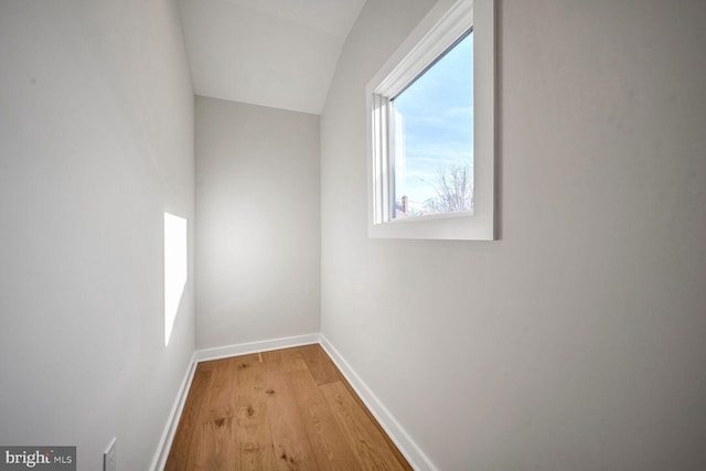 additional living space with light hardwood / wood-style floors