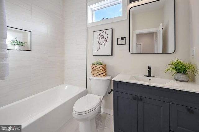 full bathroom featuring vanity, tiled shower / bath combo, and toilet