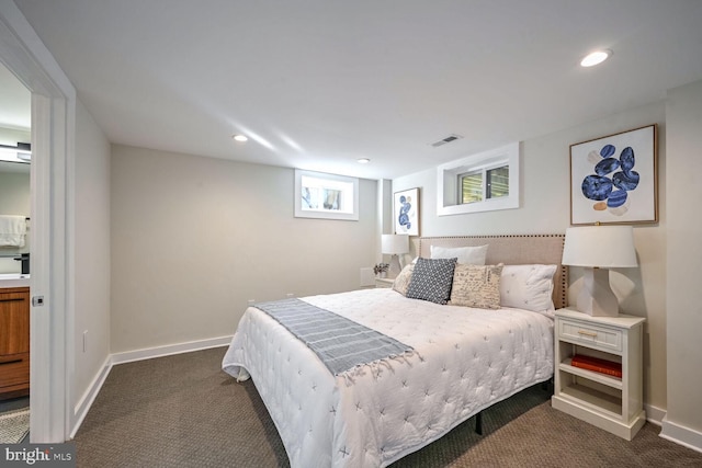 bedroom featuring dark carpet