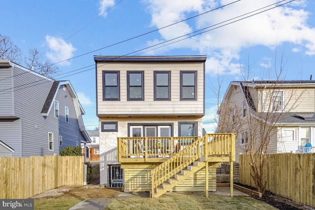 rear view of house with a deck