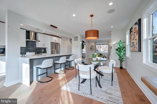 dining area featuring light wood-type flooring