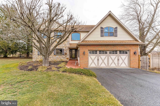 view of front of home featuring a garage and a front yard