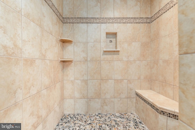 bathroom featuring tiled shower