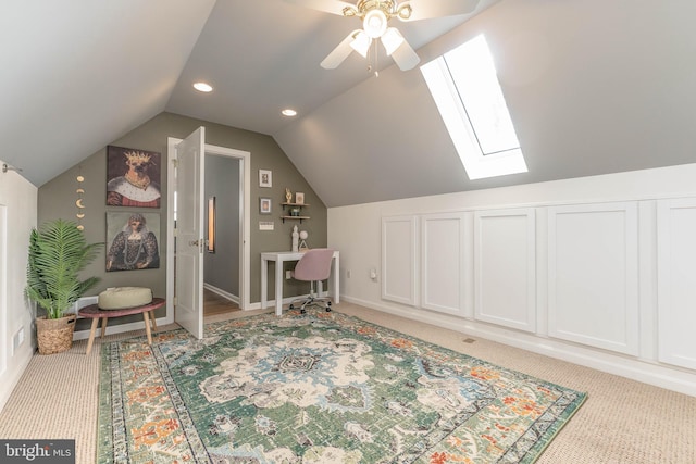 interior space featuring lofted ceiling, light colored carpet, and ceiling fan