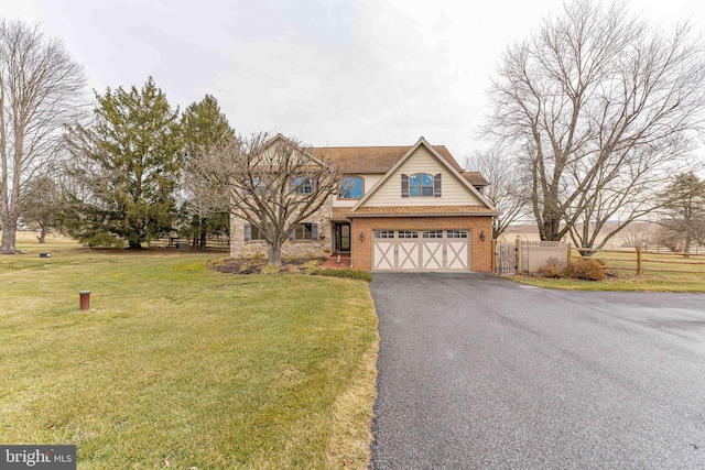 view of front of house featuring a garage and a front yard