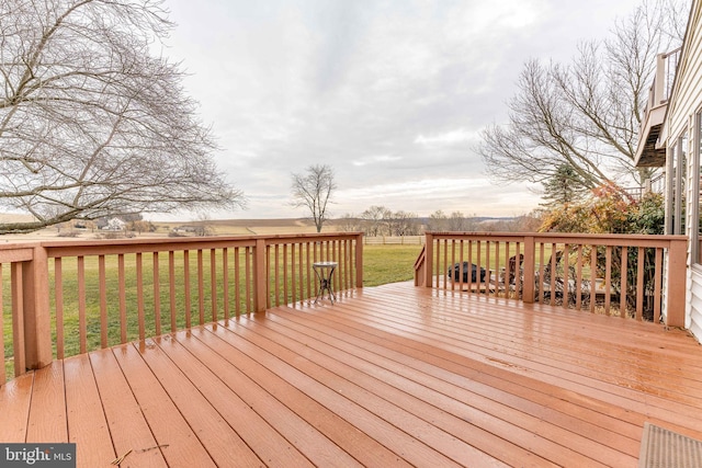 wooden terrace with a yard