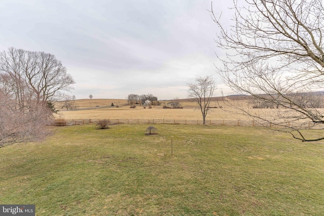 view of yard with a rural view