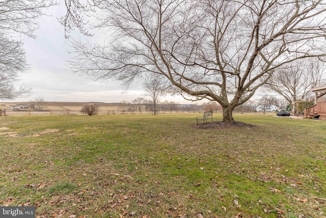 view of yard with a rural view