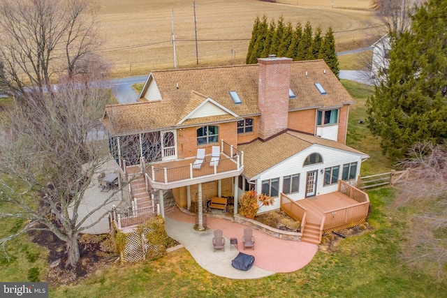 back of house with a patio and a wooden deck