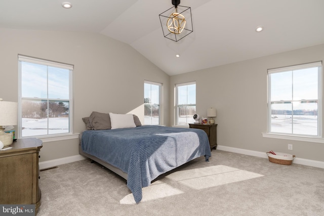 carpeted bedroom featuring lofted ceiling