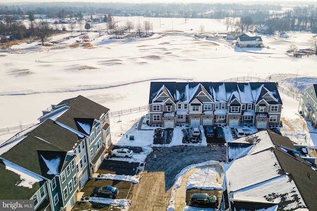 snowy aerial view featuring a residential view