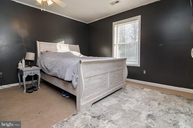 bedroom featuring ceiling fan and light colored carpet