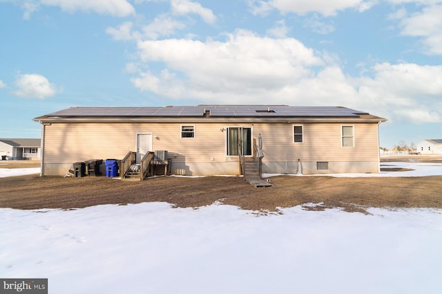 view of snow covered house