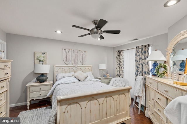 bedroom featuring dark hardwood / wood-style flooring and ceiling fan