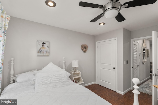 bedroom with ceiling fan and dark hardwood / wood-style flooring