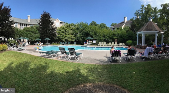 view of pool with a gazebo, a patio area, and a lawn